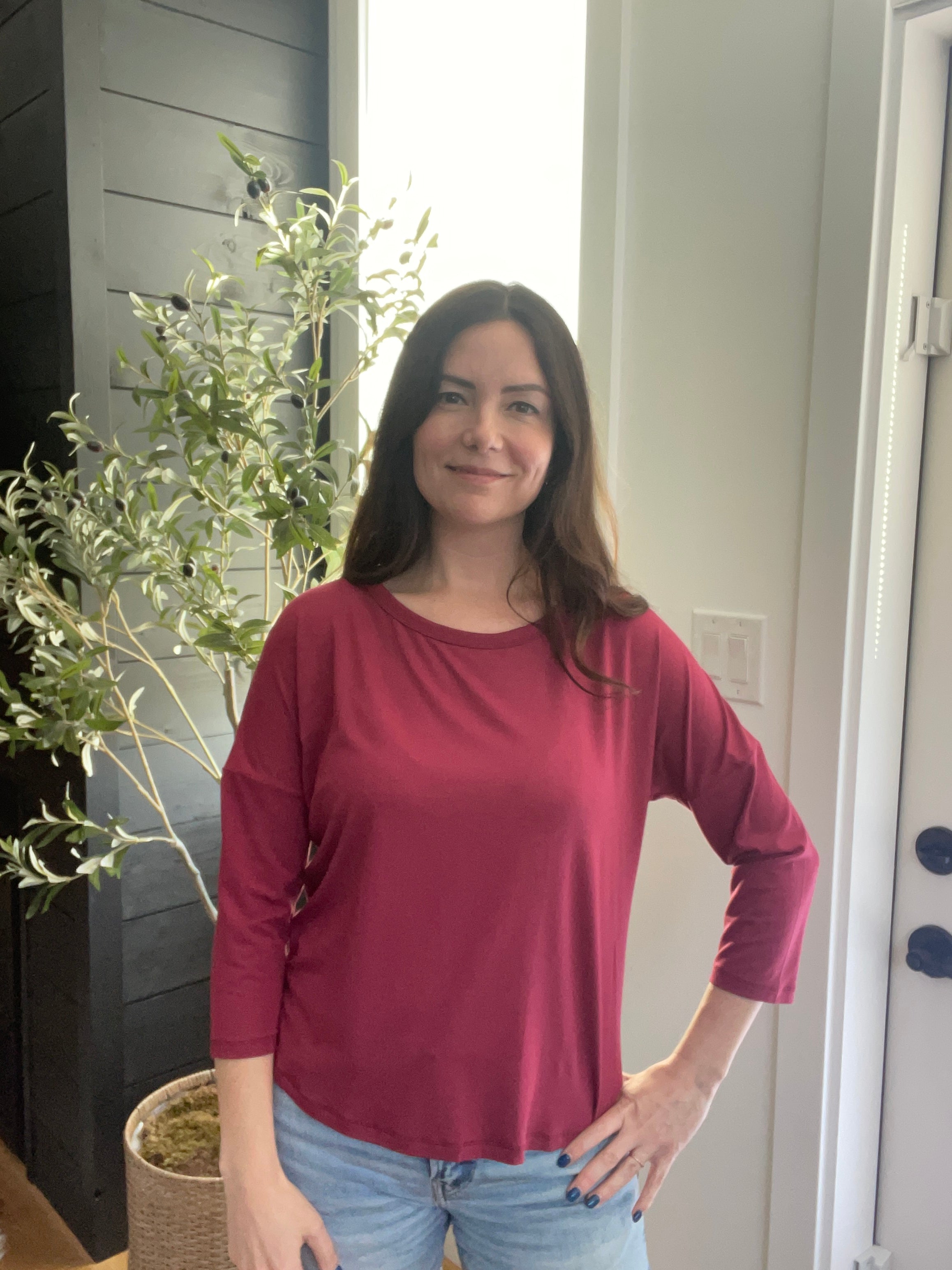 Model wearing Bamboo red 3/4 sleeve t-shirt made in canada