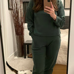 Model wearing forest green fleece eco-friendly loungwear set