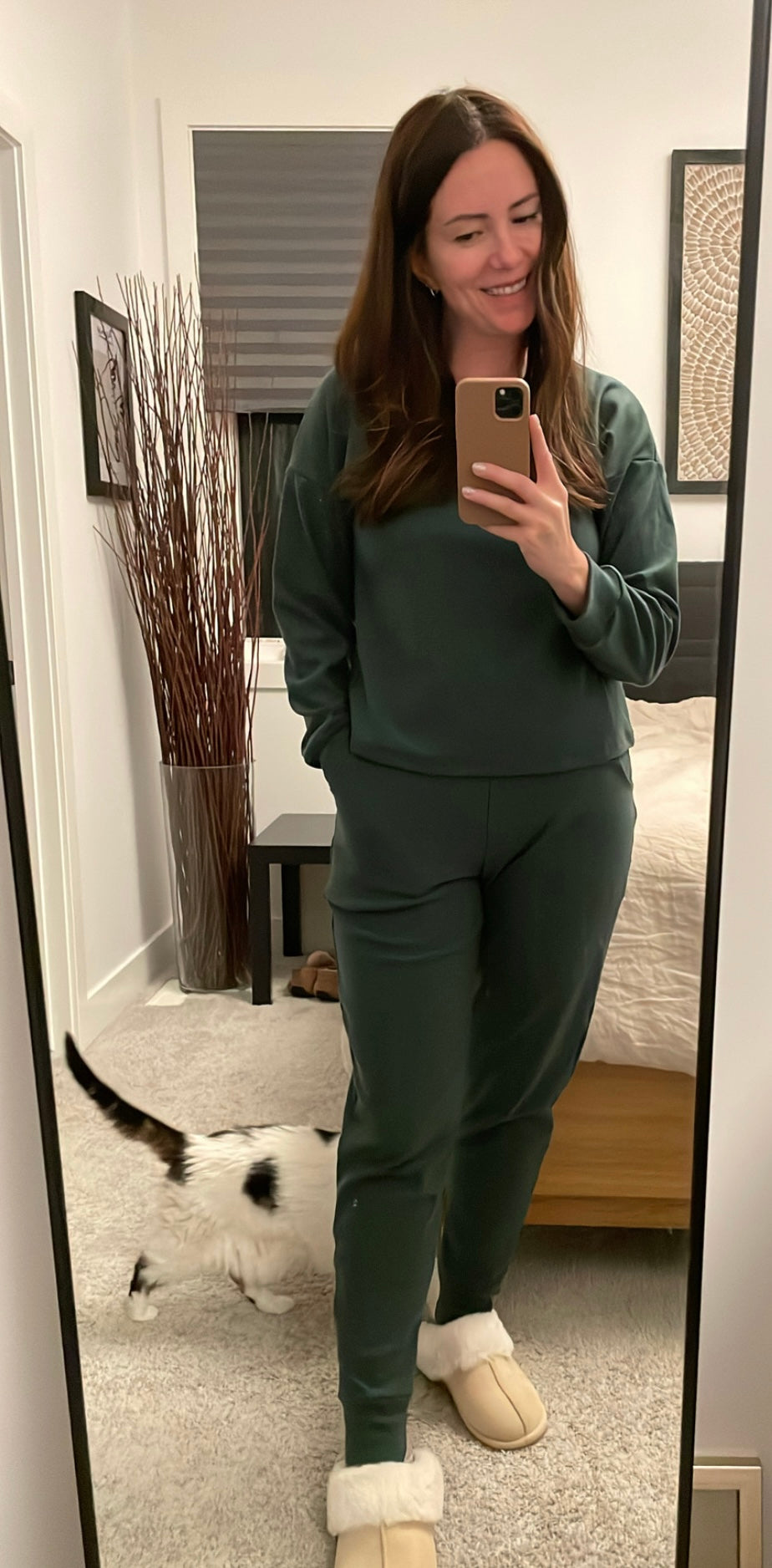 Model wearing forest green fleece eco-friendly loungwear set