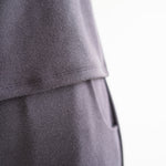 close up of front pocket high waist wide leg pants for women in grey