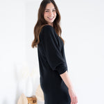 side view of black knee length sweater knit dress for women