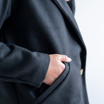 close up of black wool coat pocket