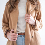 mockneck cream sweater with camel wool coat