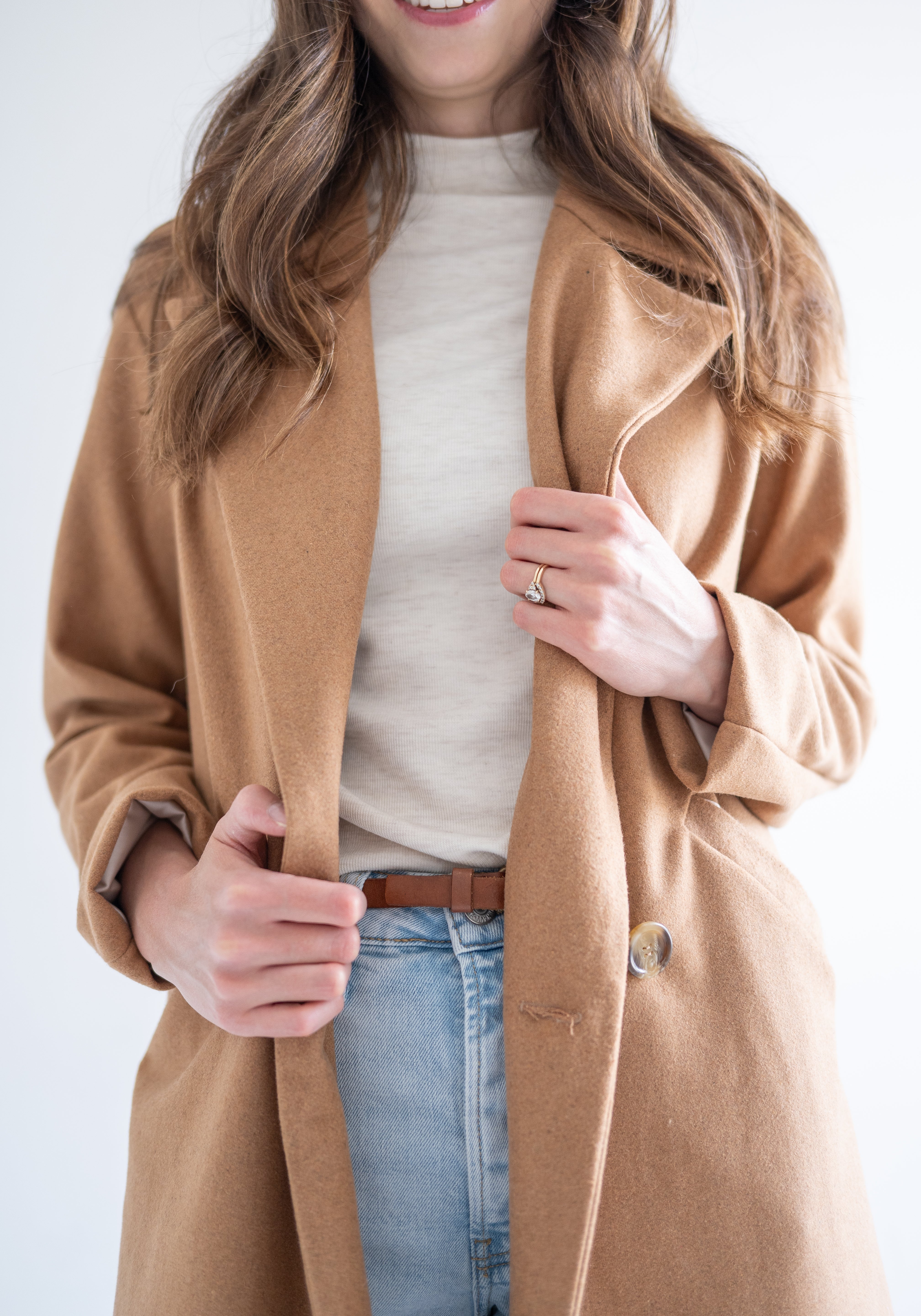 mockneck cream sweater with camel wool coat