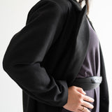 size view of black wool blend coat with grey long sleeved dress