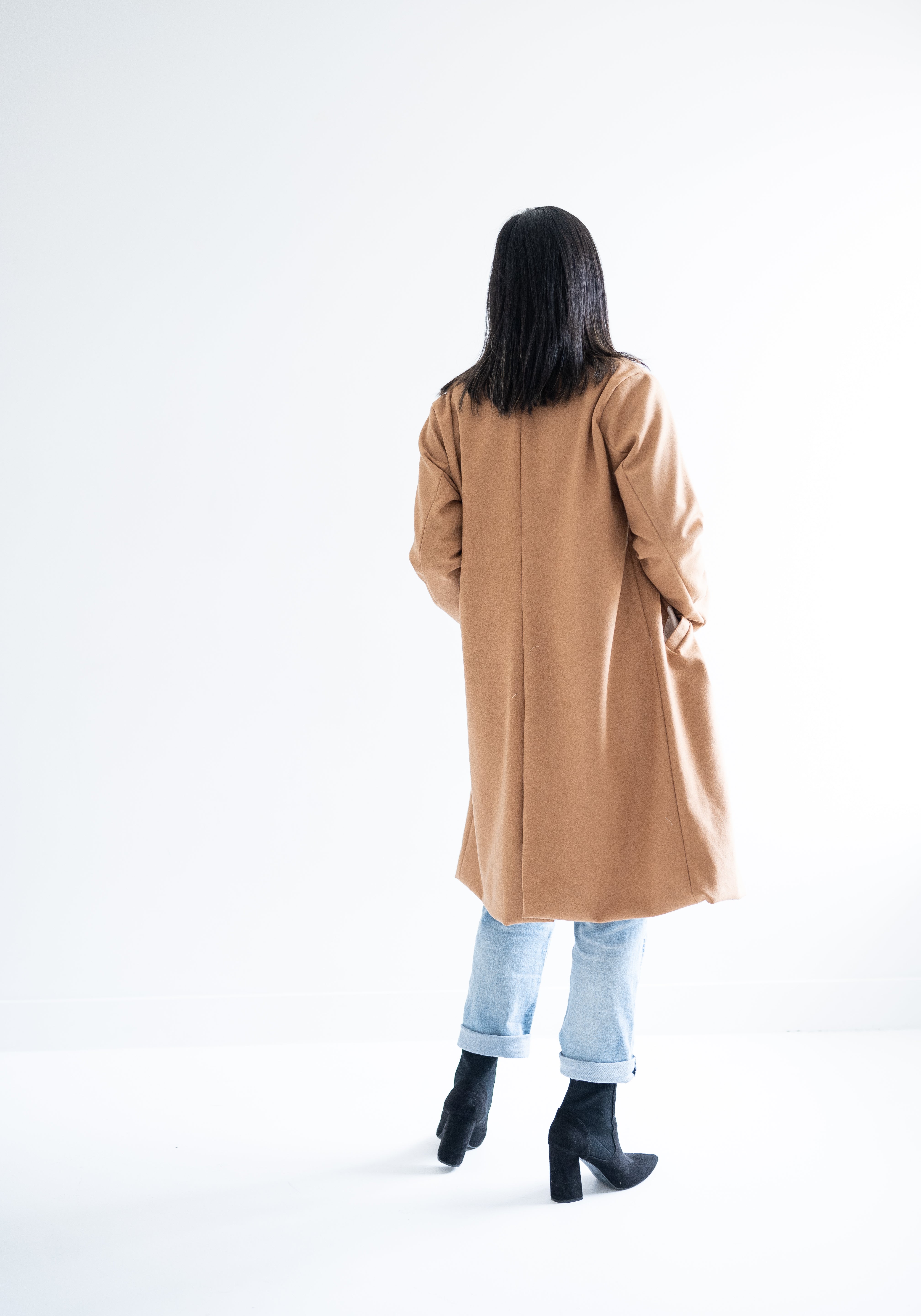 back view of camel wool coat for women
