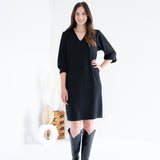 front view of black vneck long sleeved sweater knit dress for women