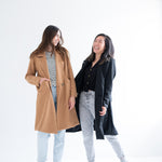 camel wool coat and black wool jacket