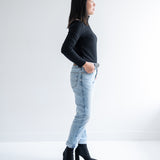 side view of black turtleneck top for women