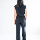 back view of sretchy wide leg pants for women and black mockneck sweater