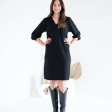 front view of black vneck long sleeved sweater knit dress for women