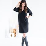 woman wearing black knee length sweater knit dress