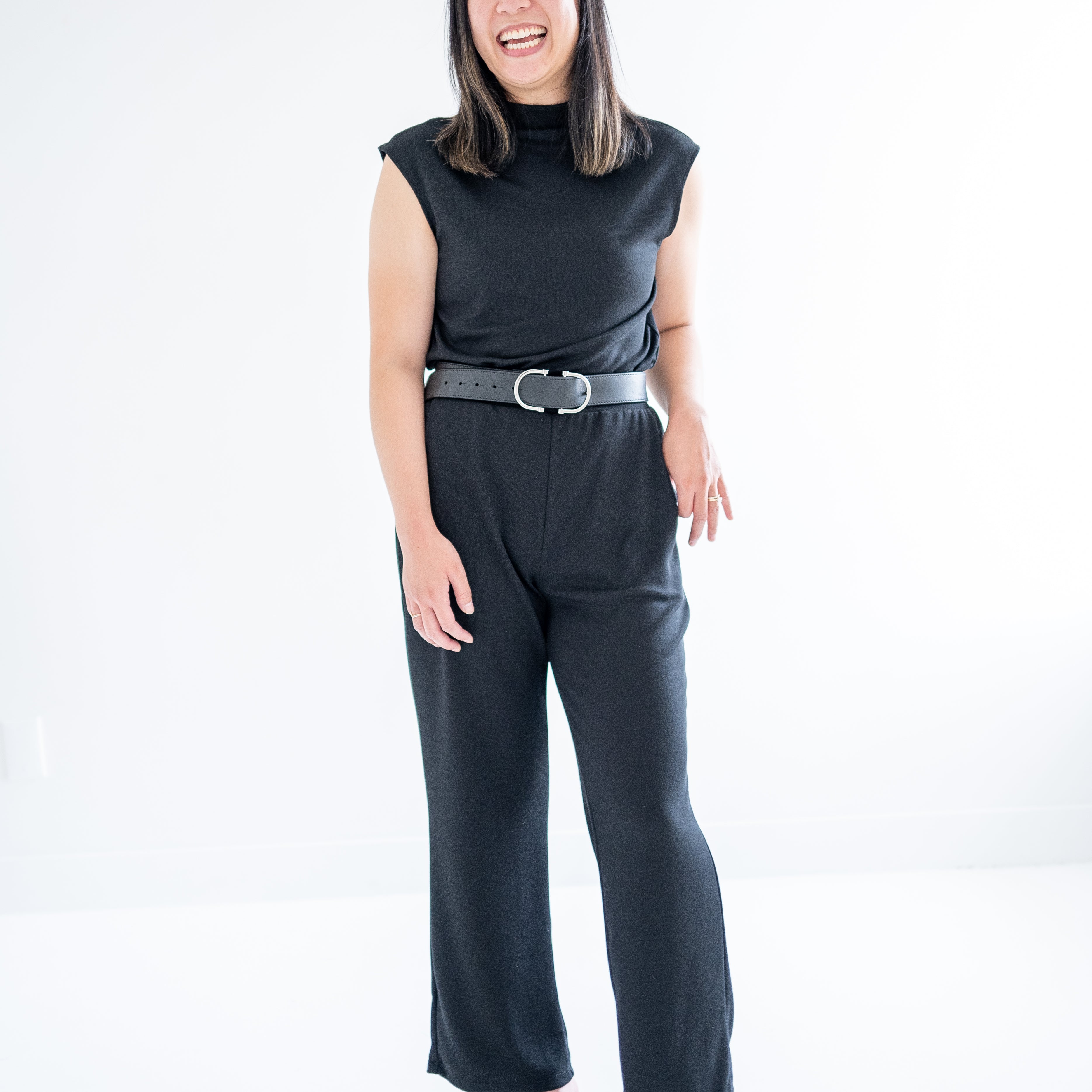 black mockneck sleeveless swaeter and wide leg pants for women