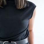 Close up of material of black wide leg pants pocket