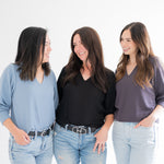 three women wearing vneck cropped sweaters