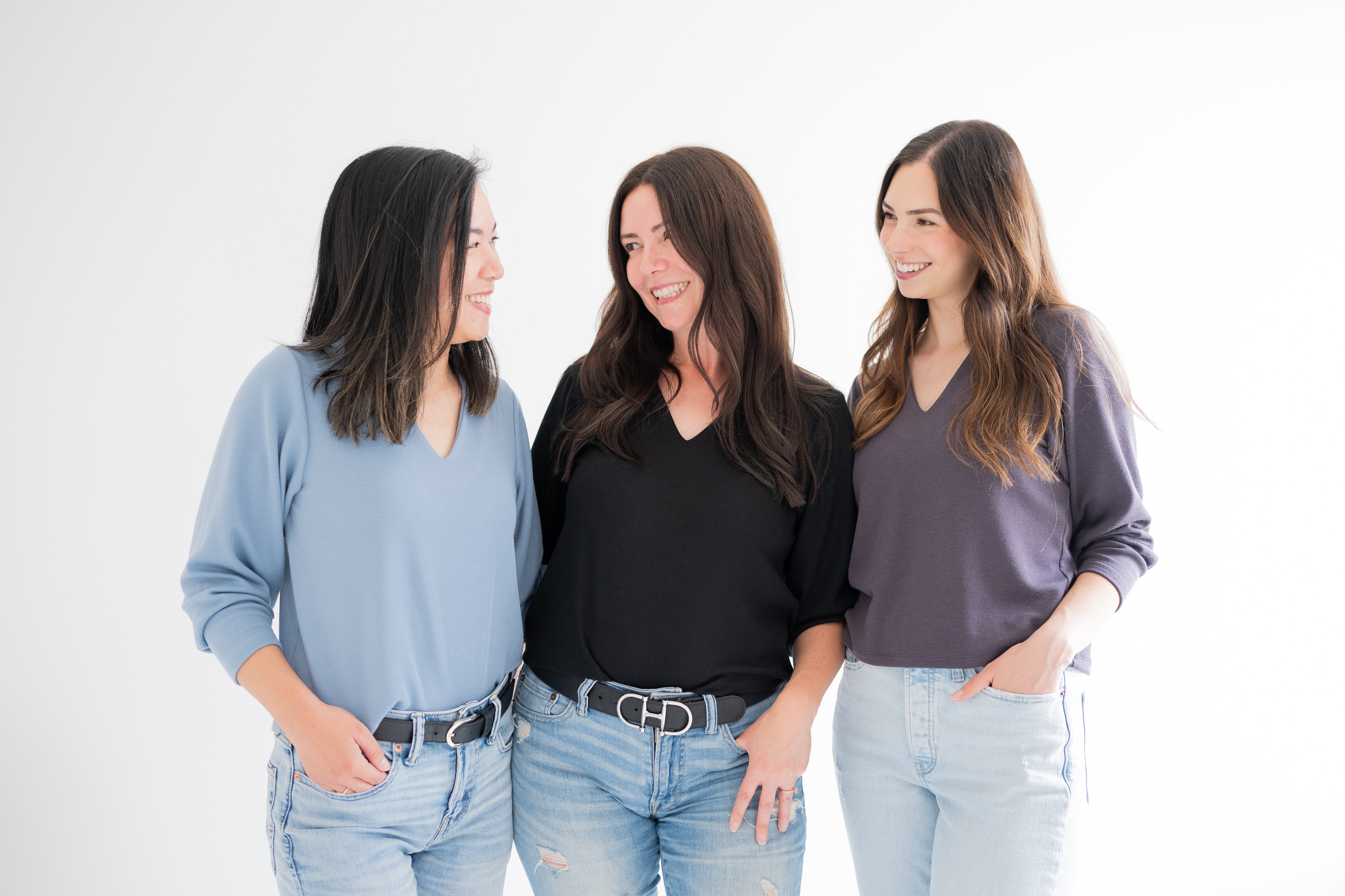 three women wearing vneck cropped sweaters