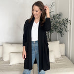 black cardigan with pockets and white v-neck t-shirt