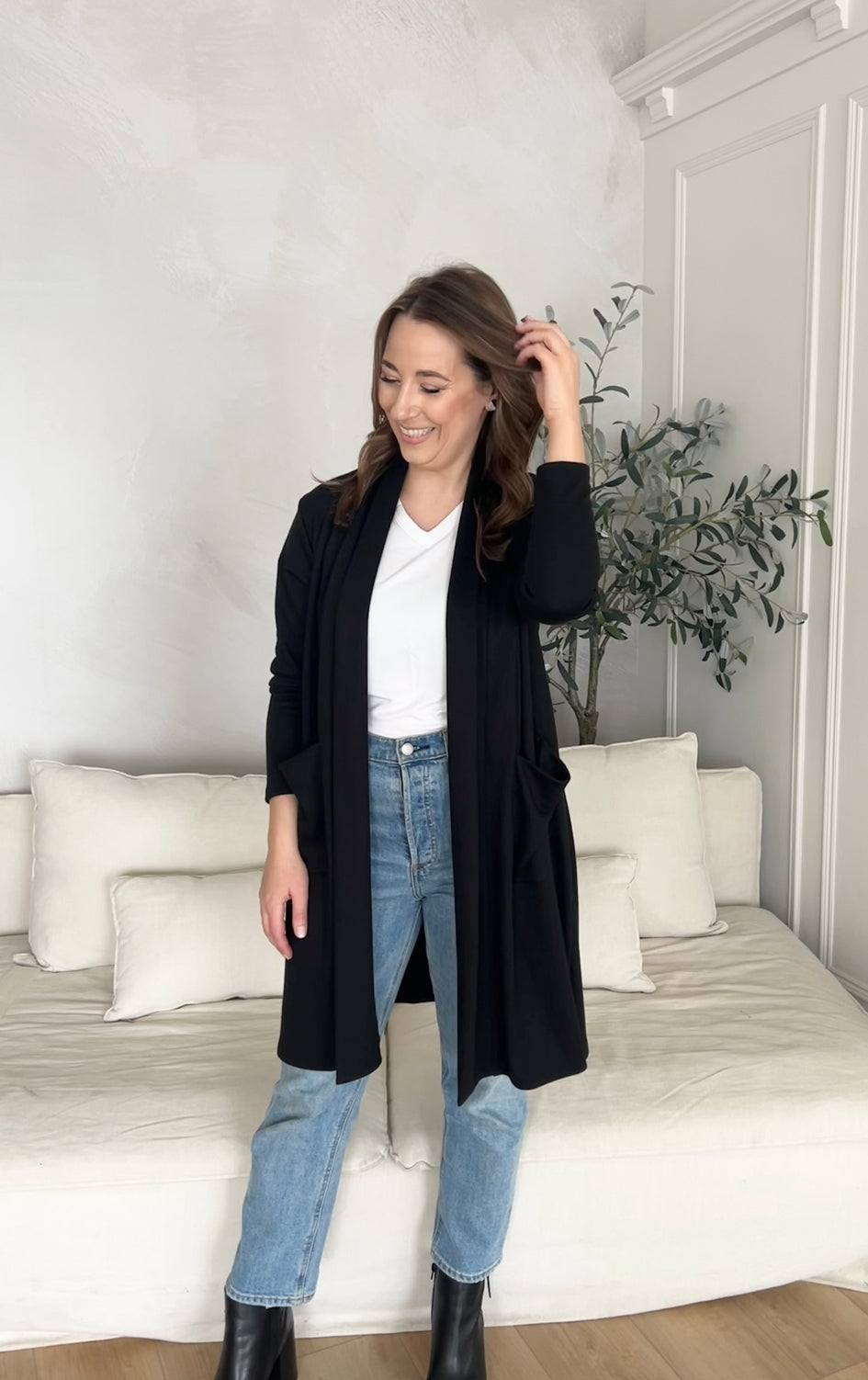 black cardigan with pockets and white v-neck t-shirt