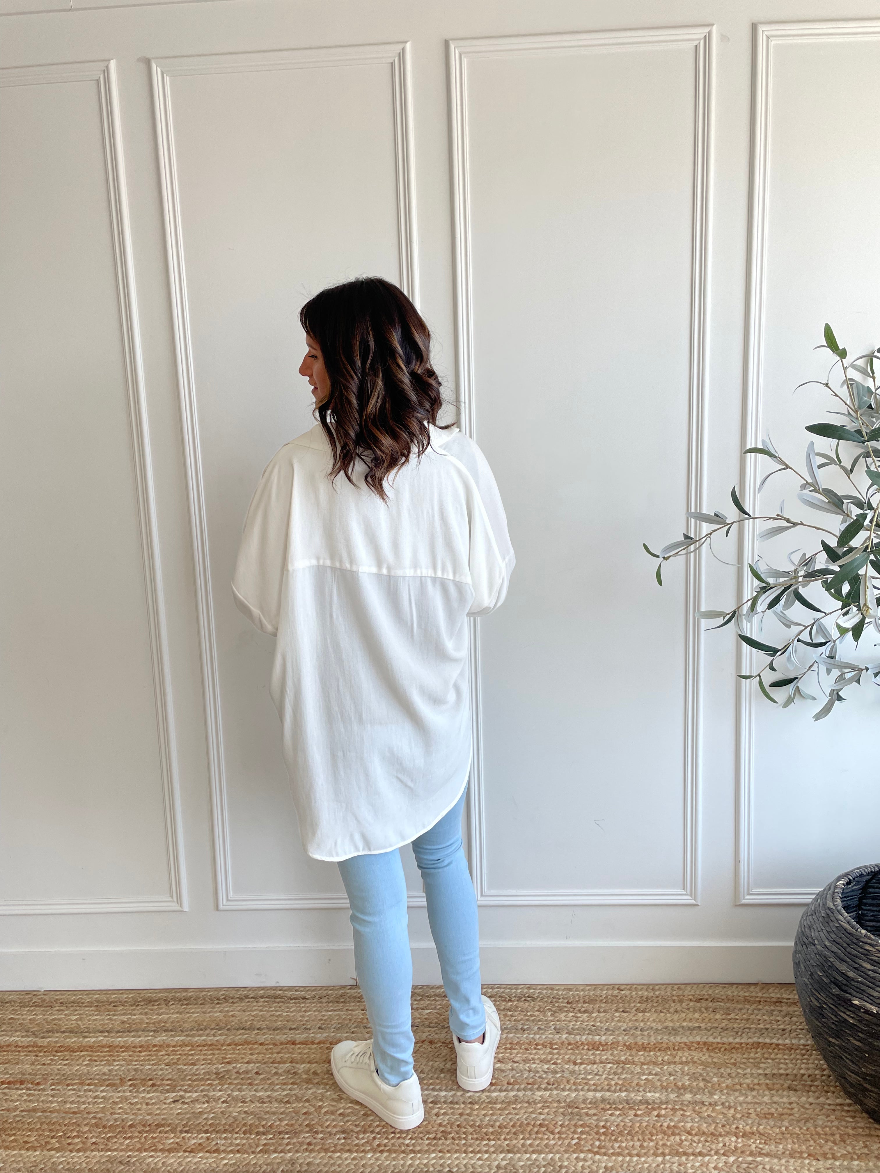 back view of white button up shirt