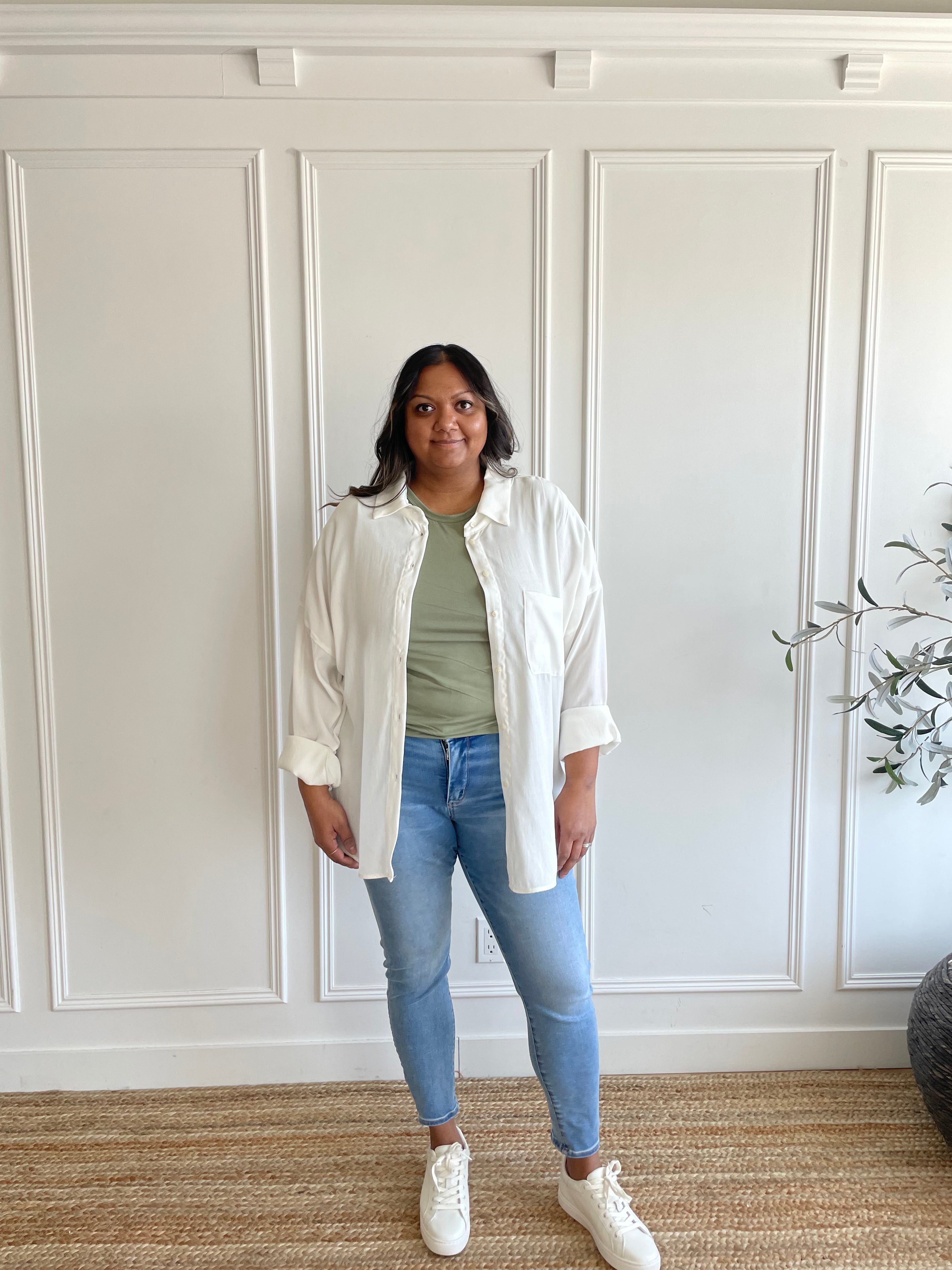 white oversized button down shirt with sage green t-shirt