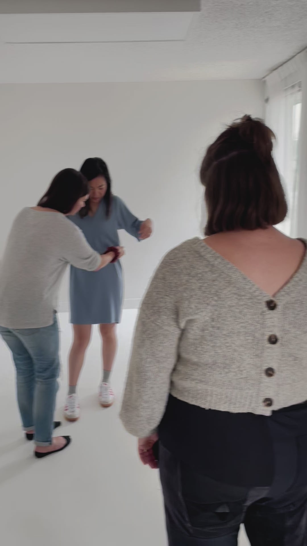 video of adding belt to blue sweater dress for women