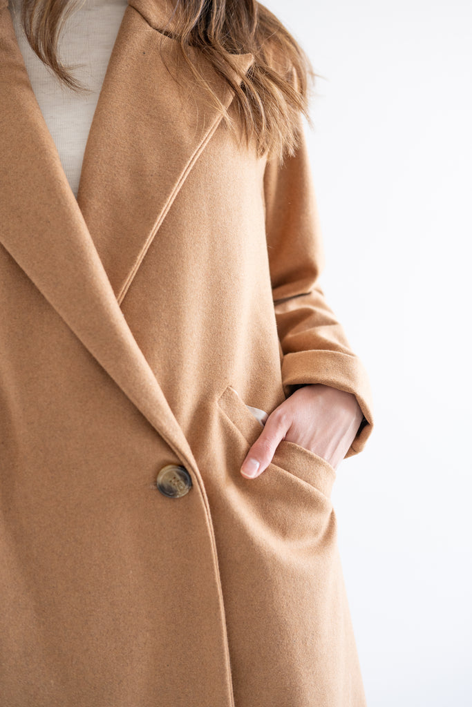 video of woman wearing a camel wool coat made in canada